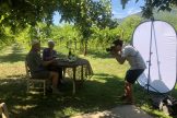 camera man with elderly couple